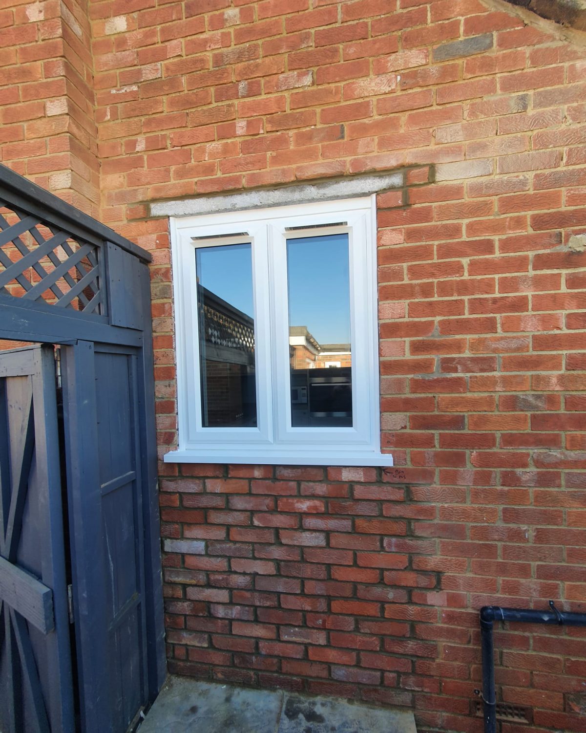 New window opening with matching red brickwork toothed in